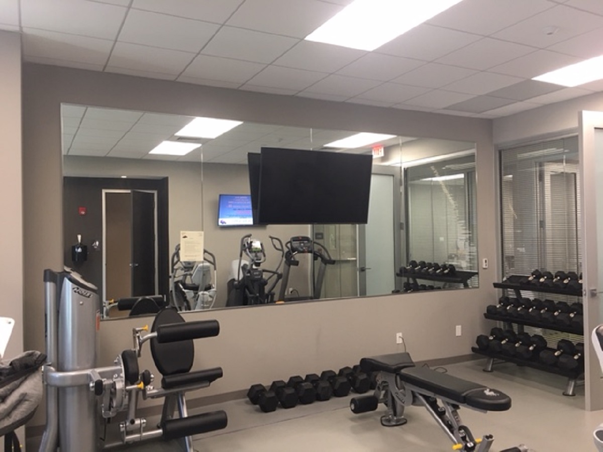 Professional glass mirror installation Miami gym fitness space