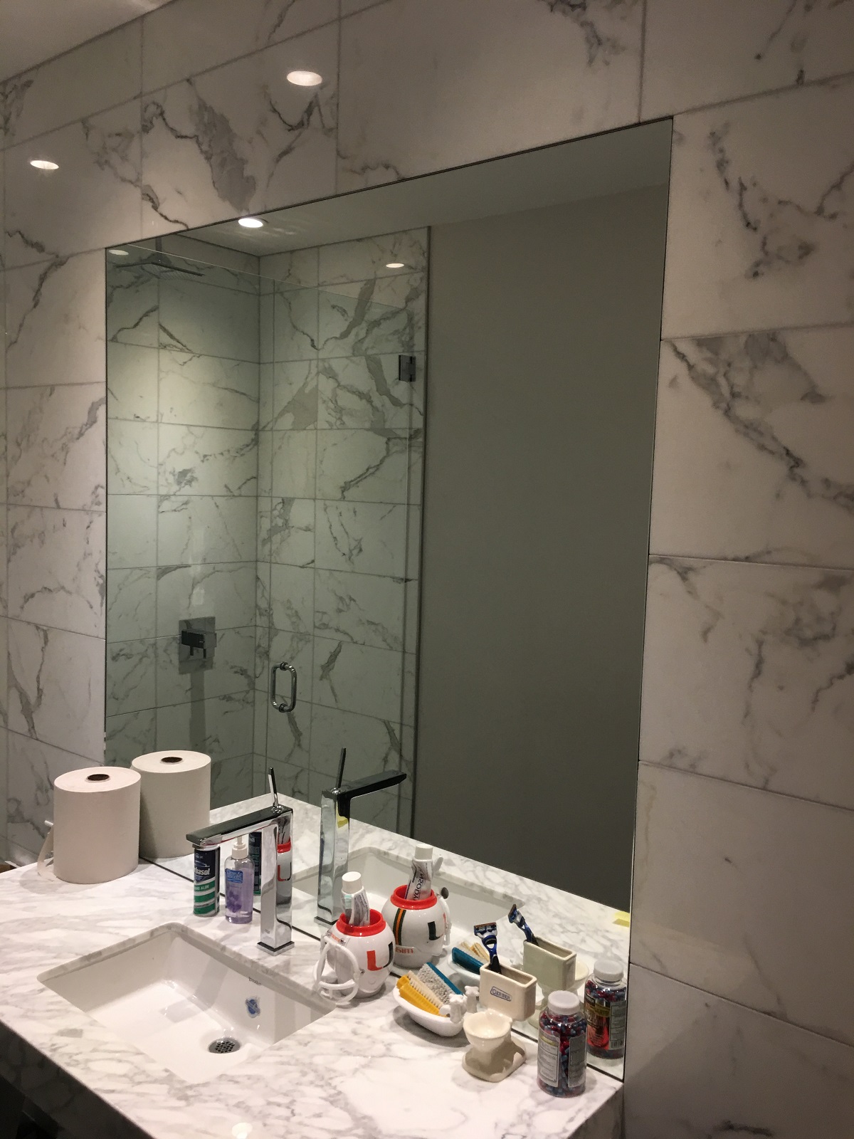 Custom vanity mirror installed in Miami bathroom