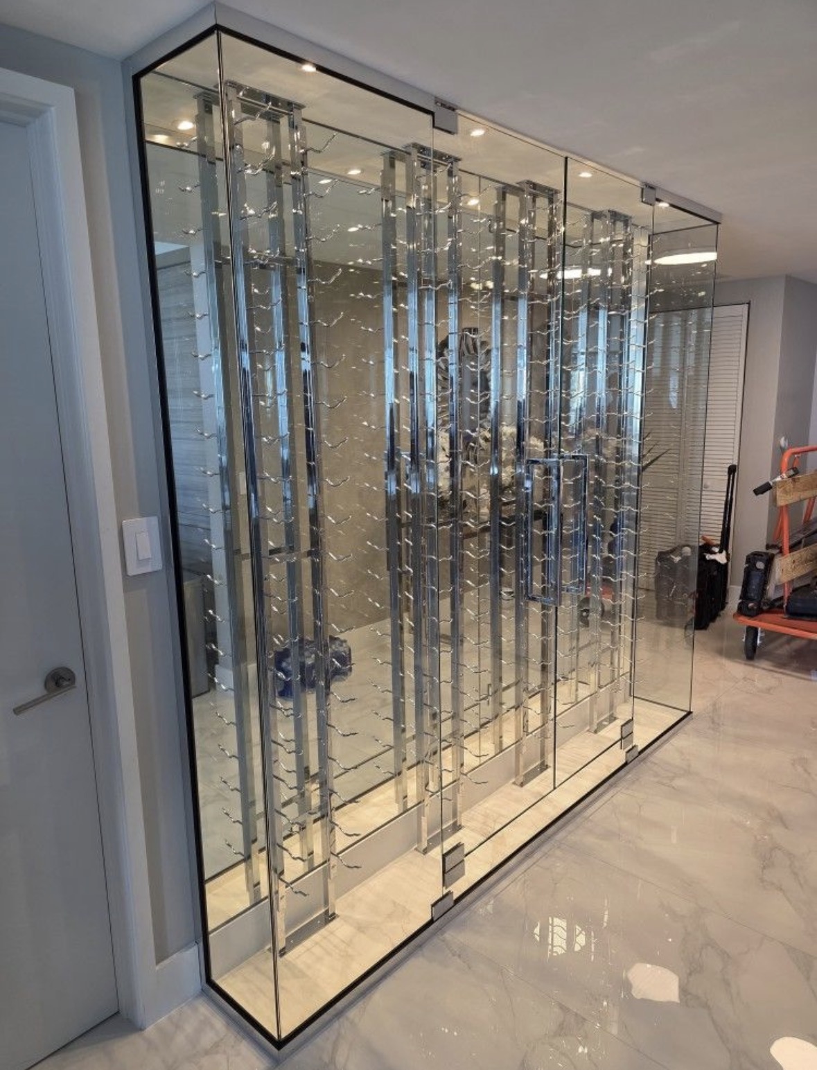 Wine cellar glass door installation Miami restaurant residential